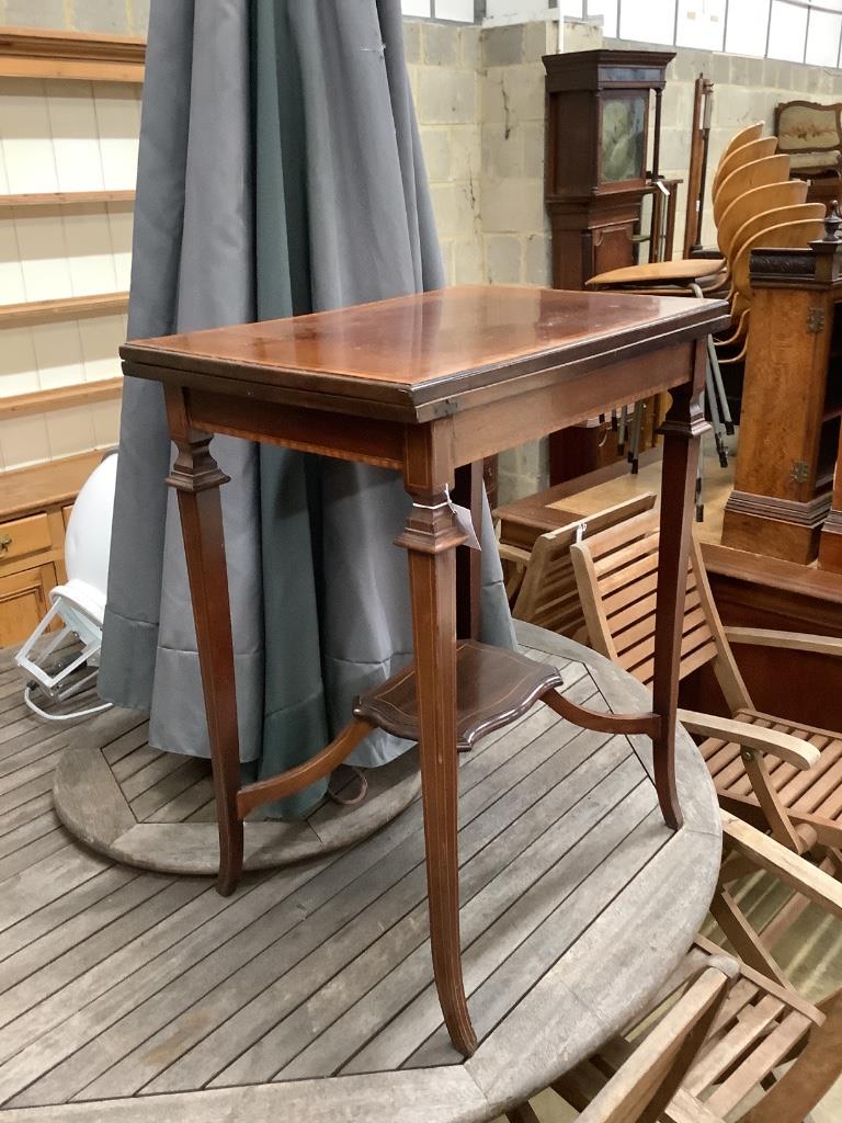 An Edwardian mahogany and satinwood banded swivel top card table, width 60cm, depth 40cm, height 74cm